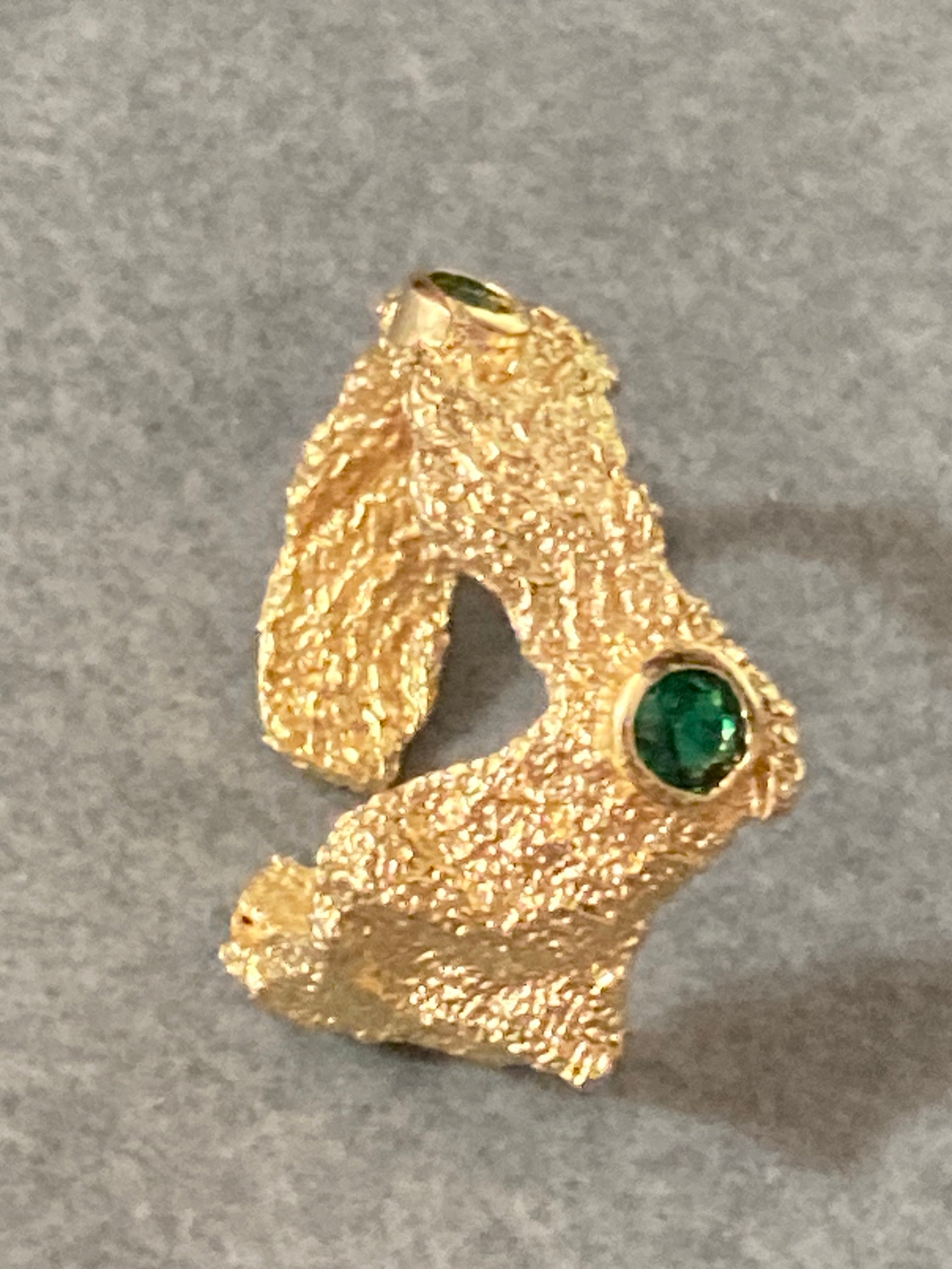 Modernist gold tone bark nugget dress ring with green stones