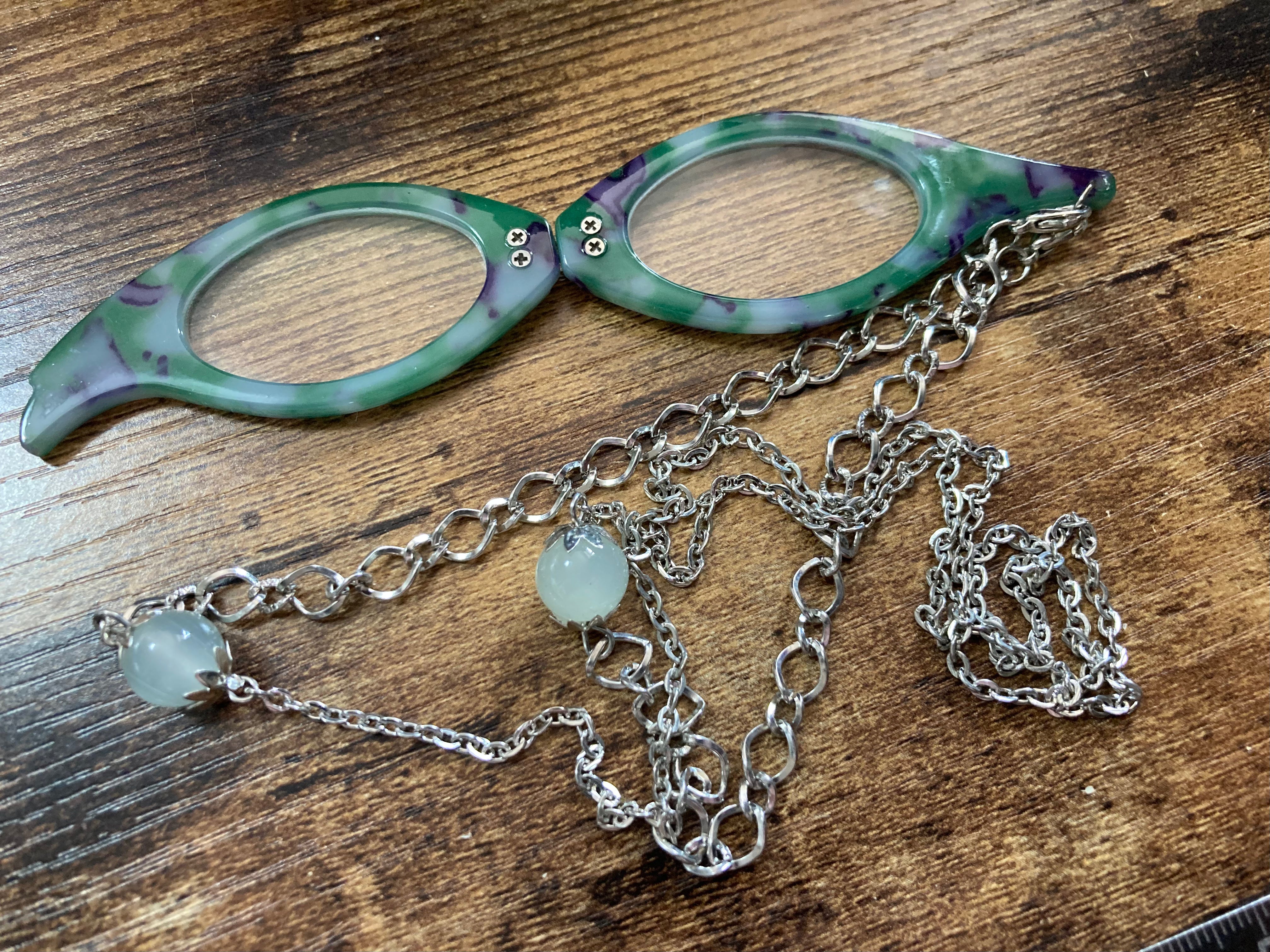 Folding green reading glasses on chain