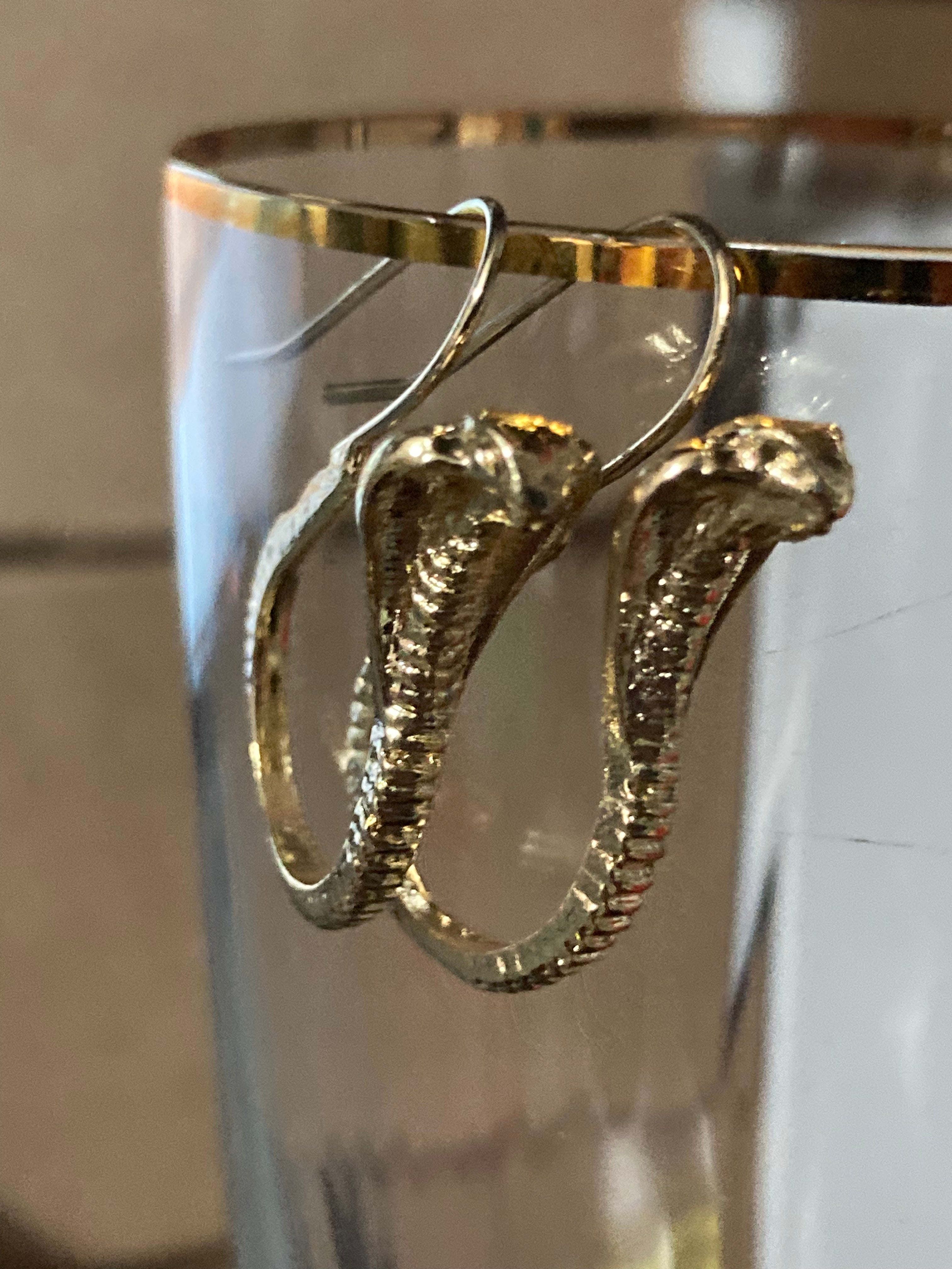 Small gold tone snake earrings