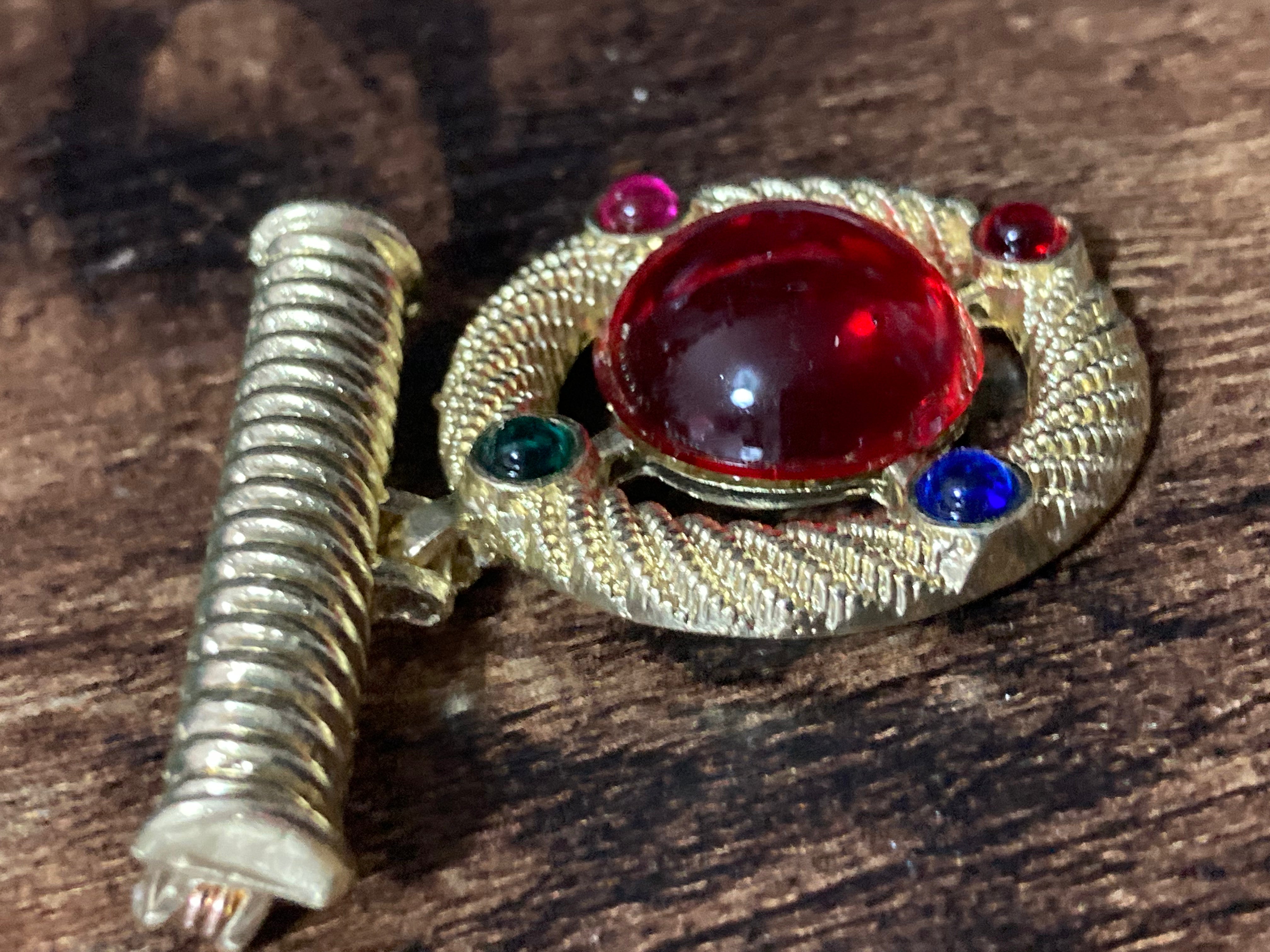 Gold medal ruby glass hanging brooch