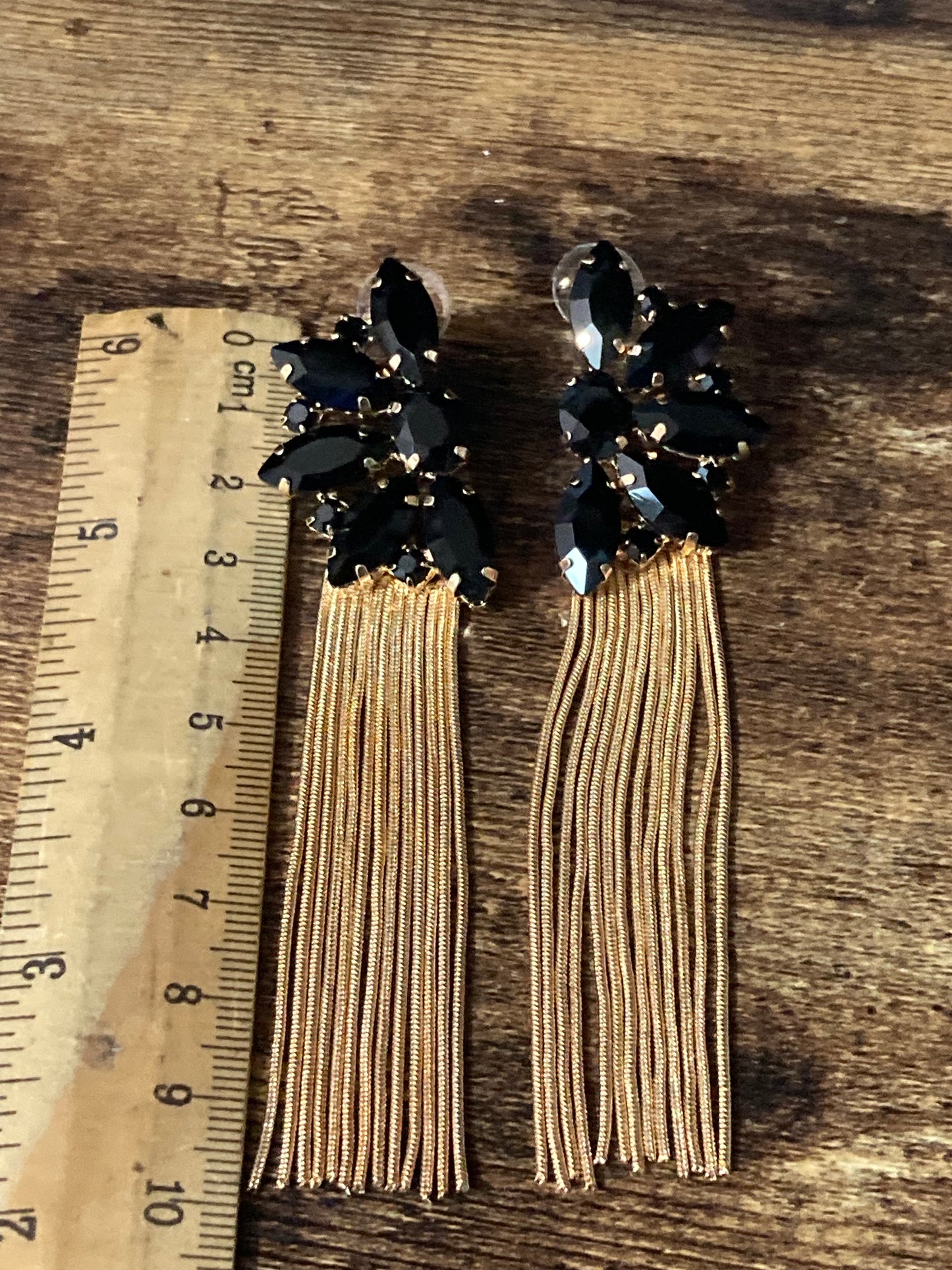 Black diamanté long gold tassel earrings