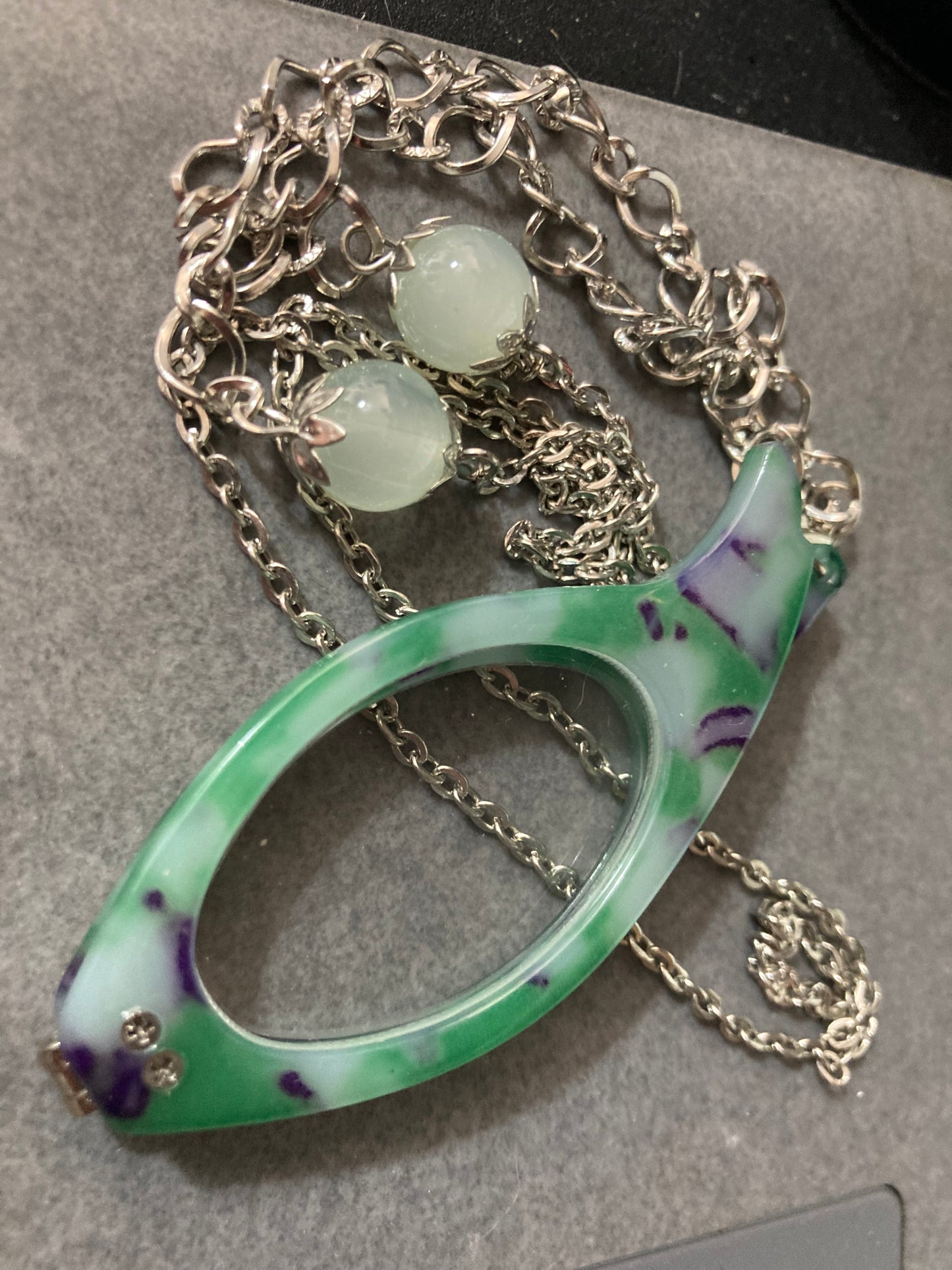 Folding green reading glasses on chain