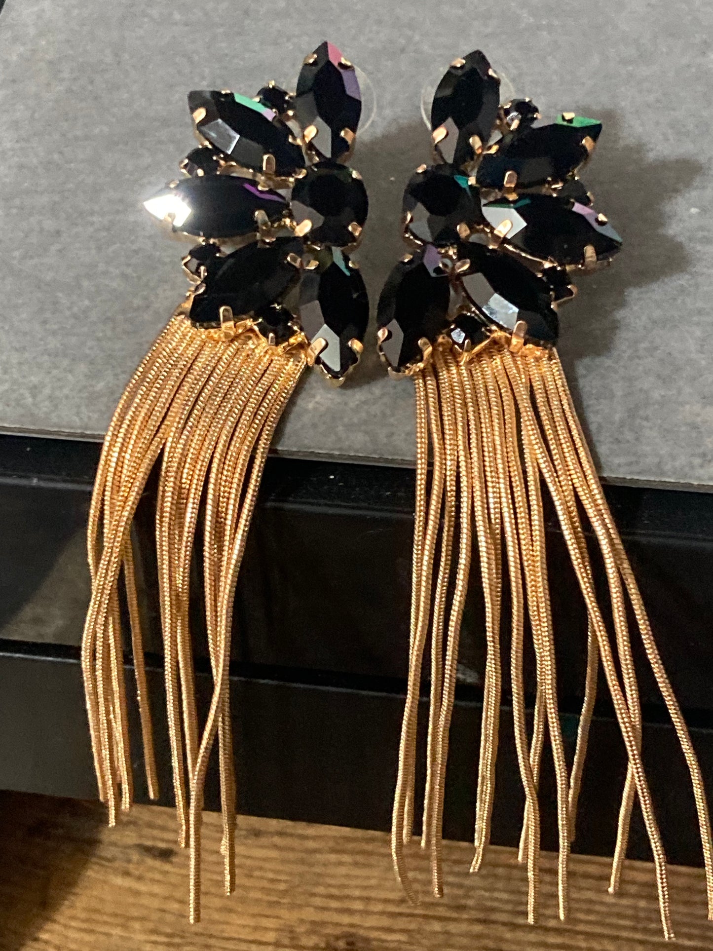 Black diamanté long gold tassel earrings