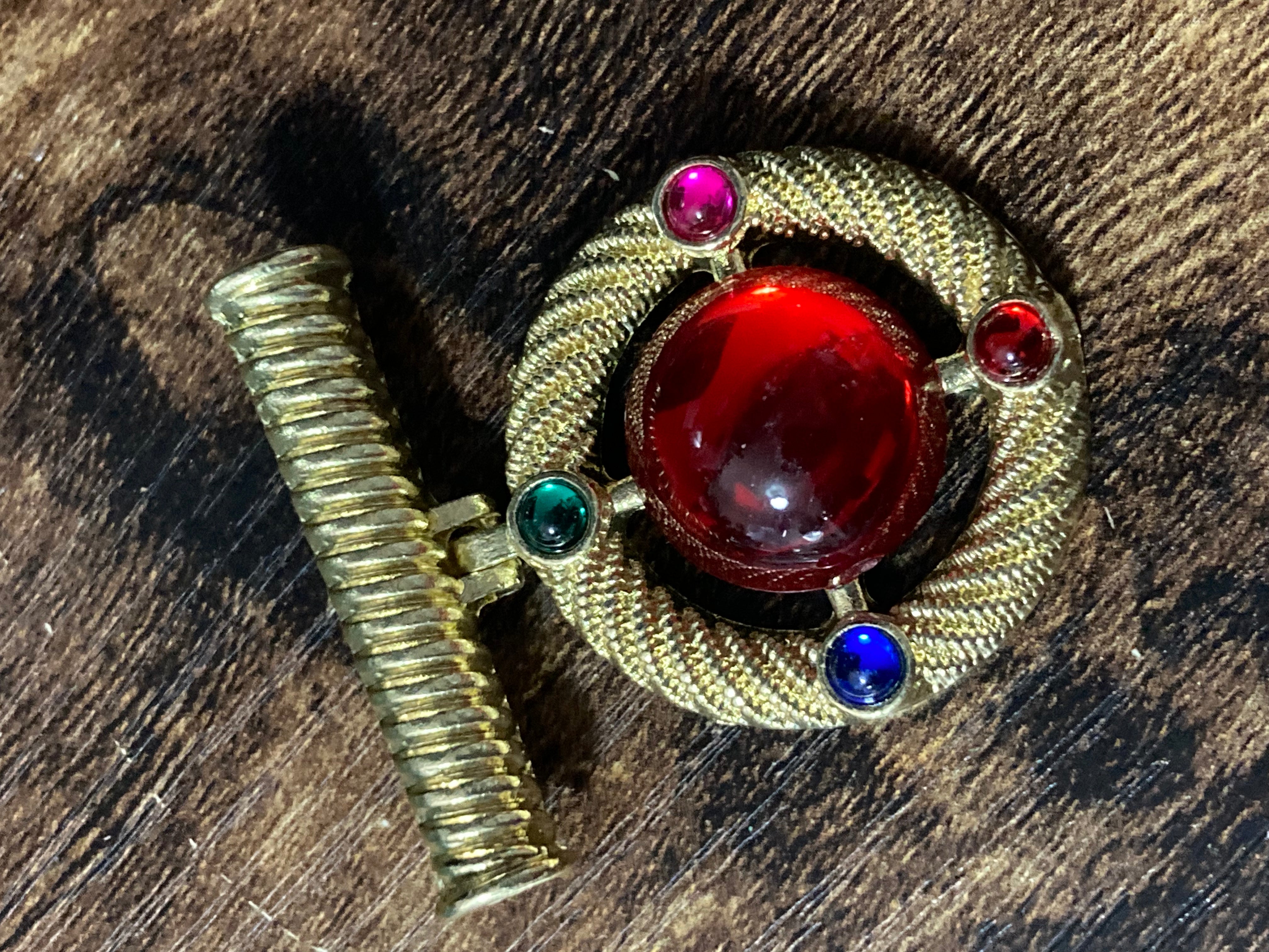 Gold medal ruby glass hanging brooch