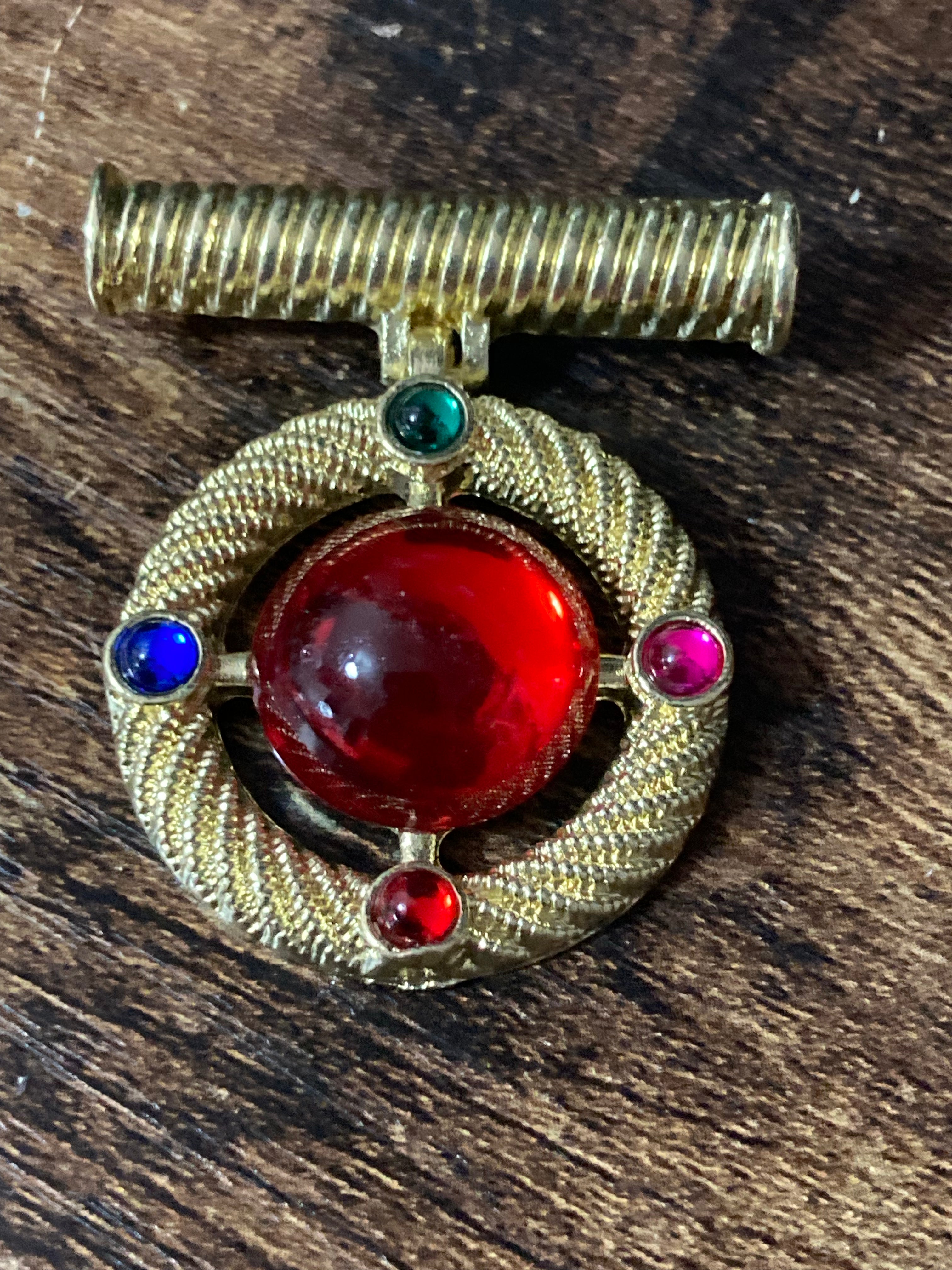 Gold medal ruby glass hanging brooch