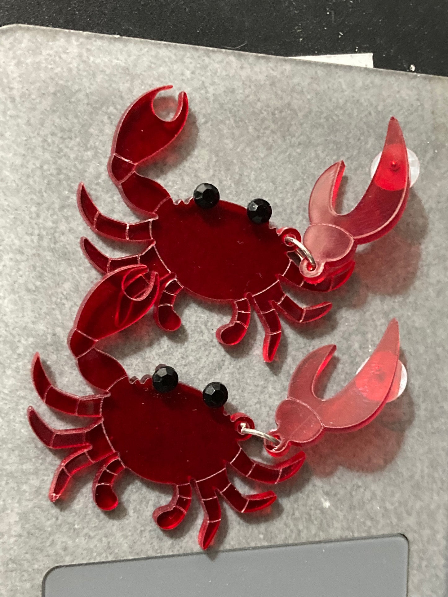 Large red acrylic crab earrings