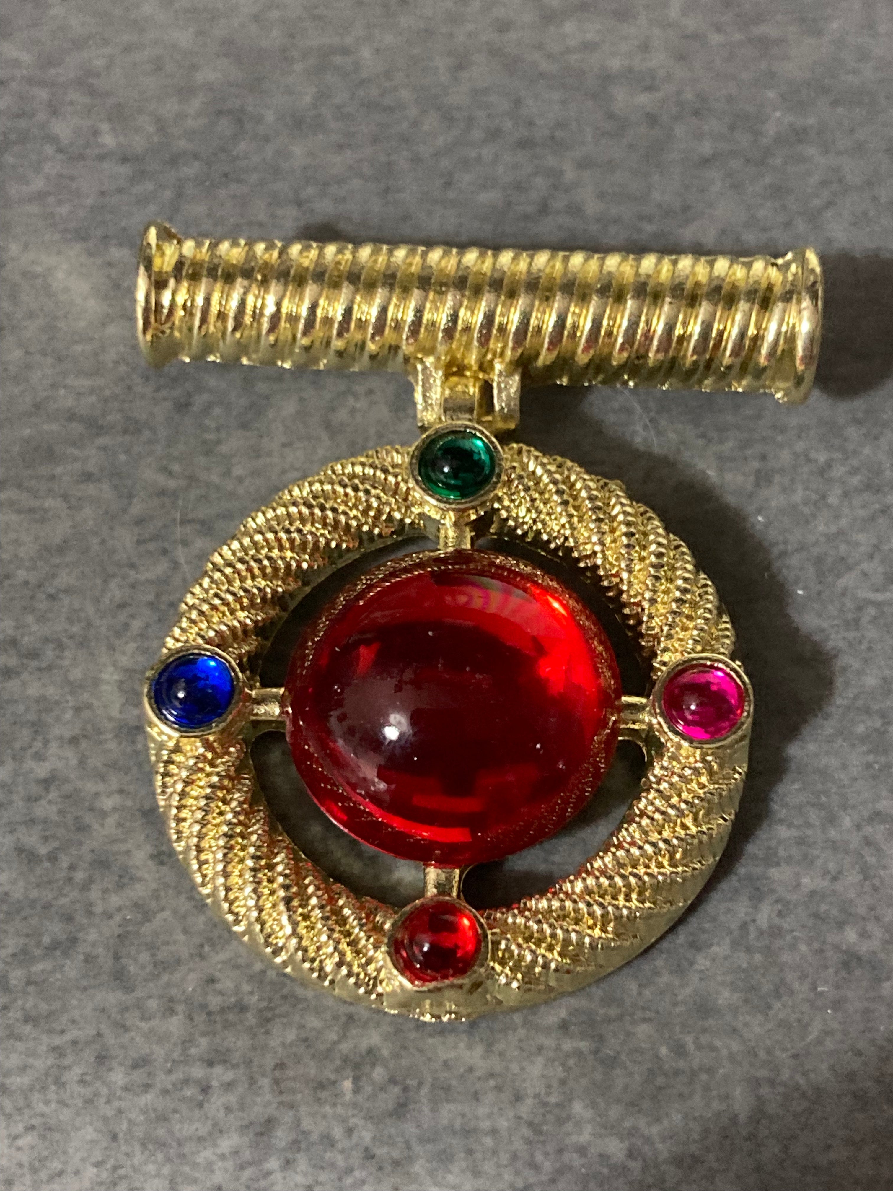 Gold medal ruby glass hanging brooch