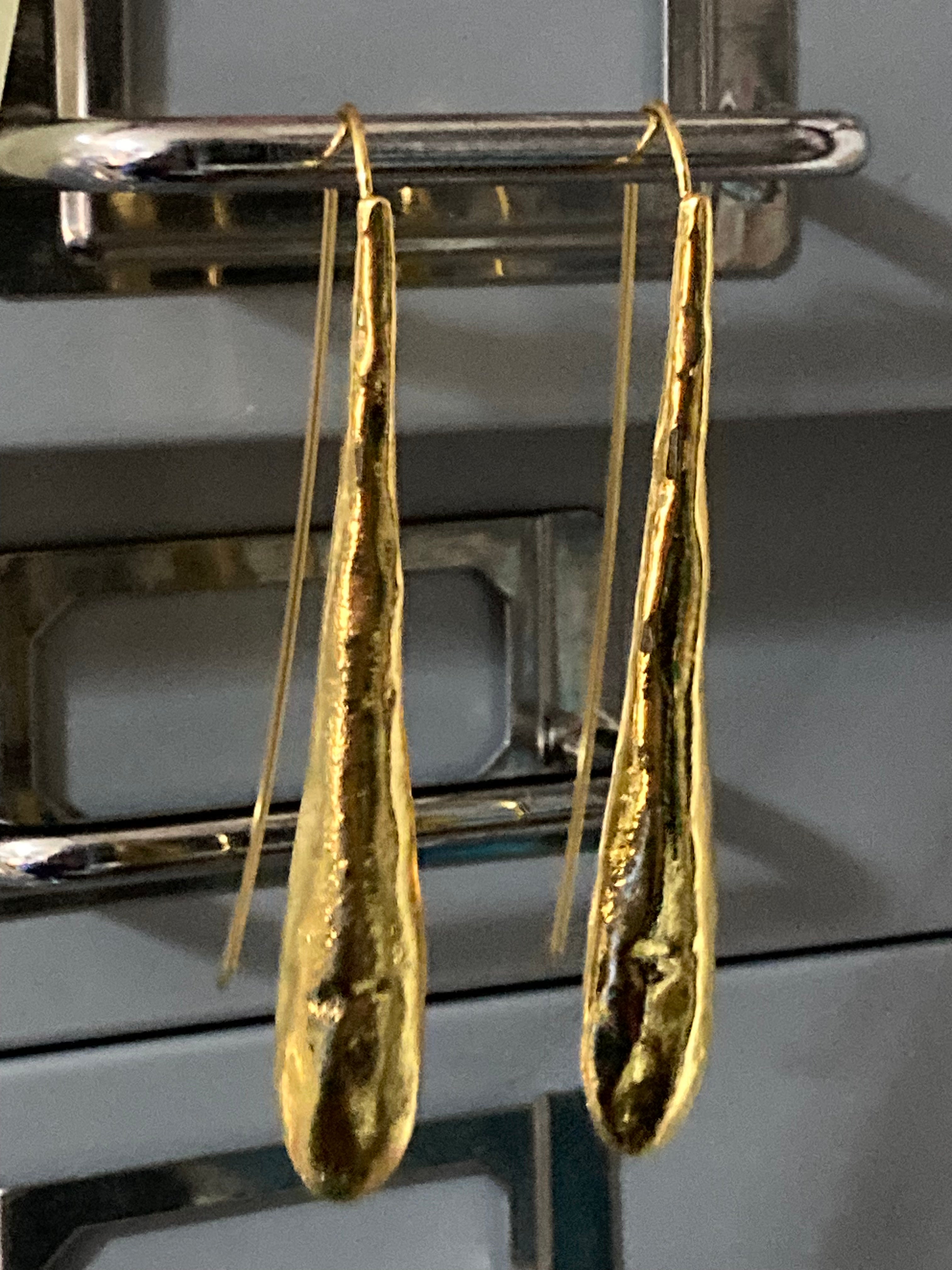 Long beaten metal drop earrings