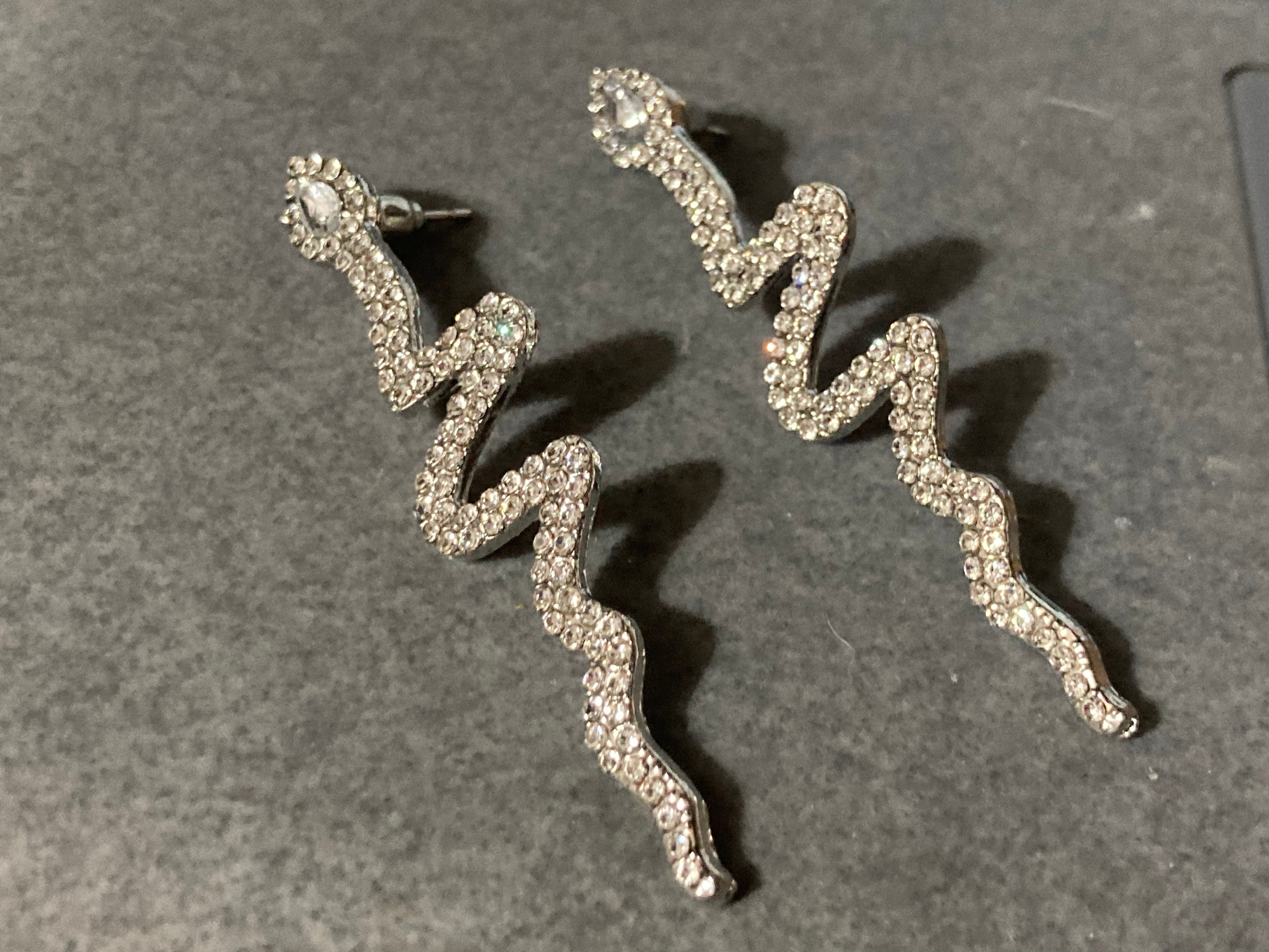 Long silver diamanté snake drop earrings