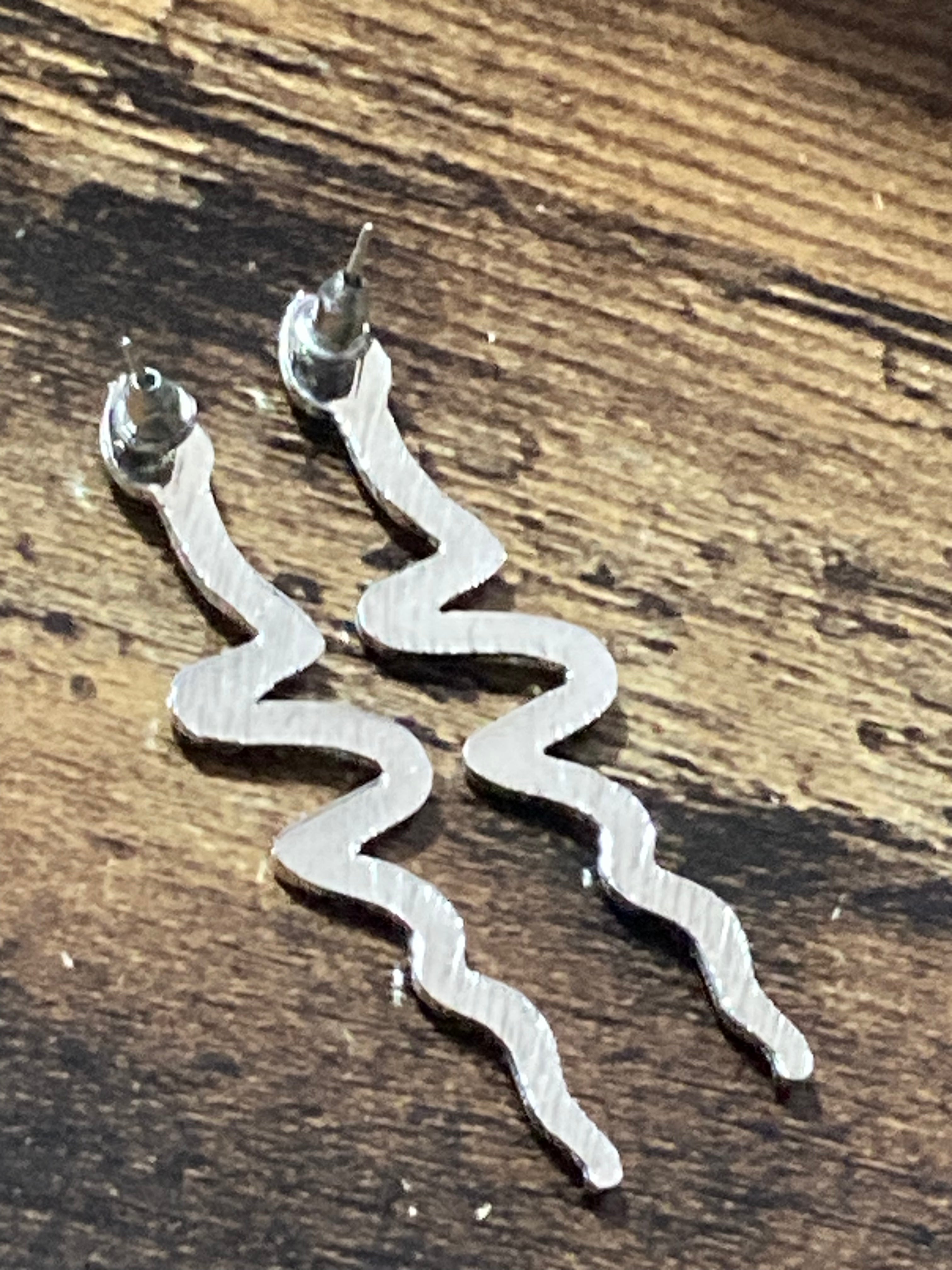 Long silver diamanté snake drop earrings