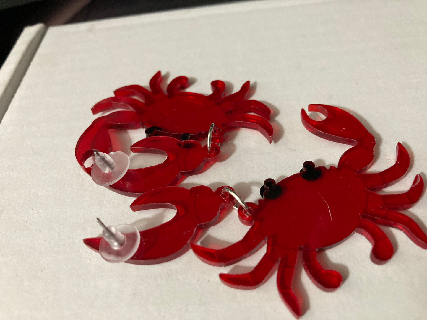 Large red acrylic crab earrings