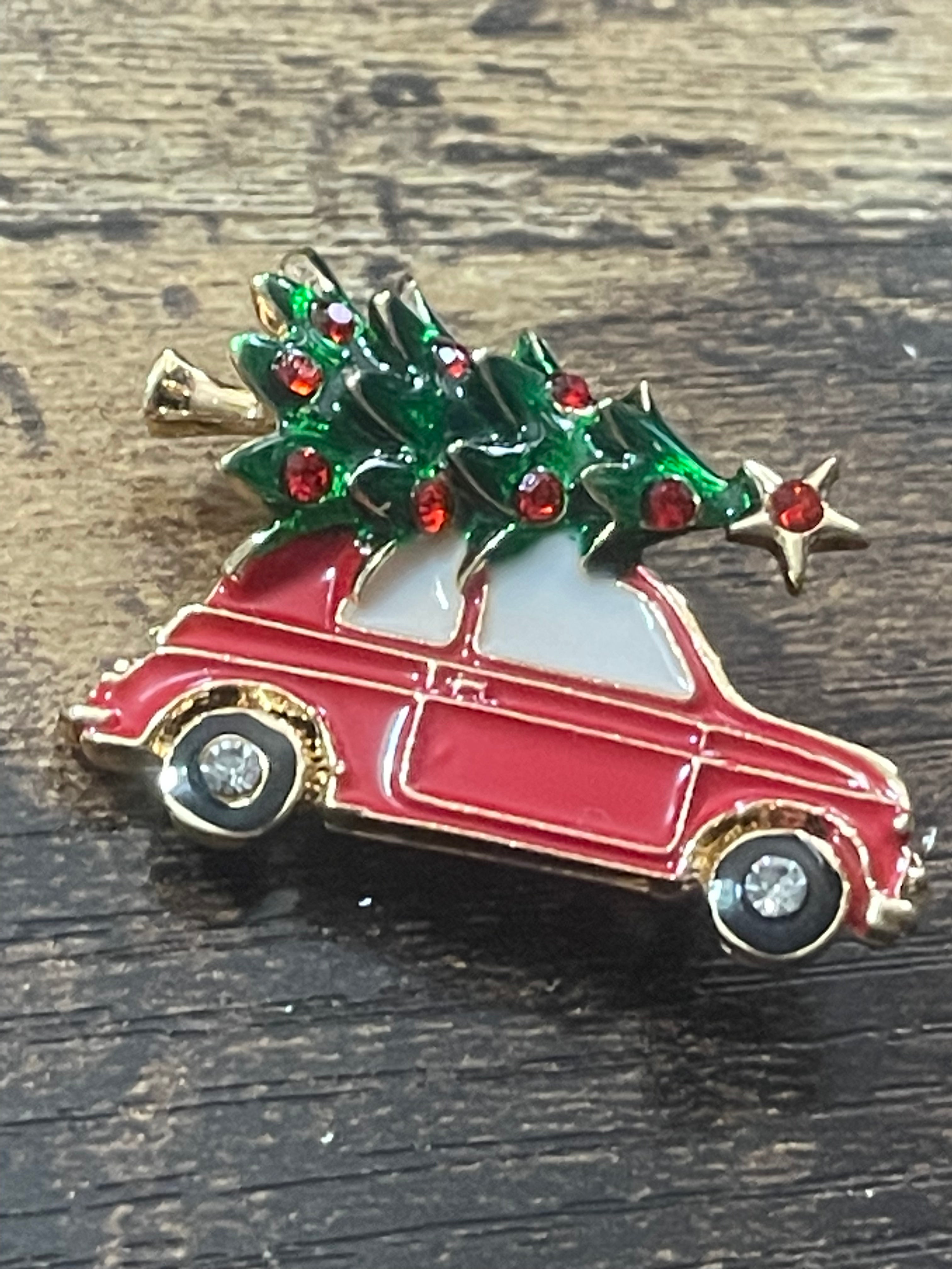 Driving home for Christmas tree and car brooch