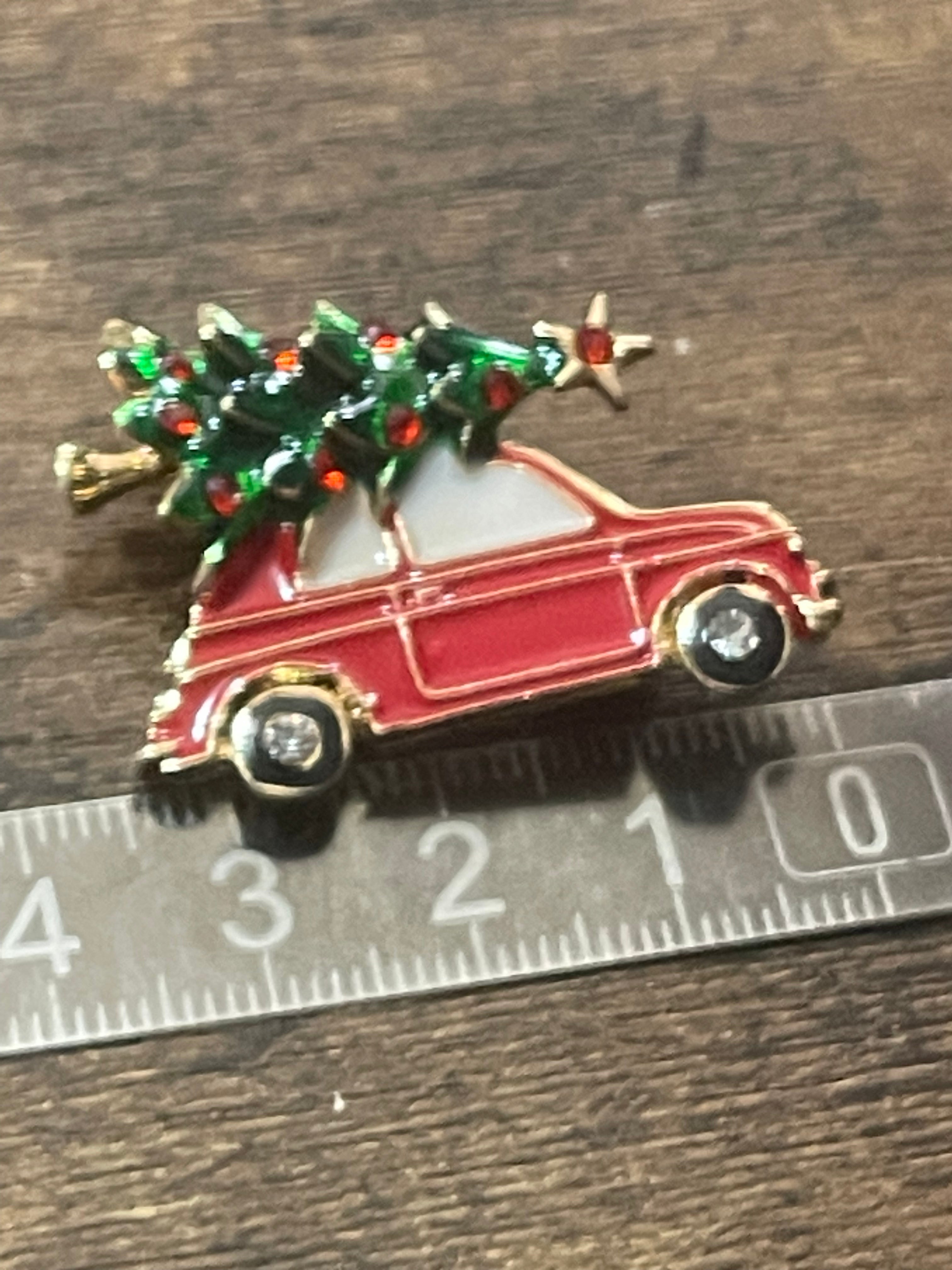 Driving home for Christmas tree and car brooch